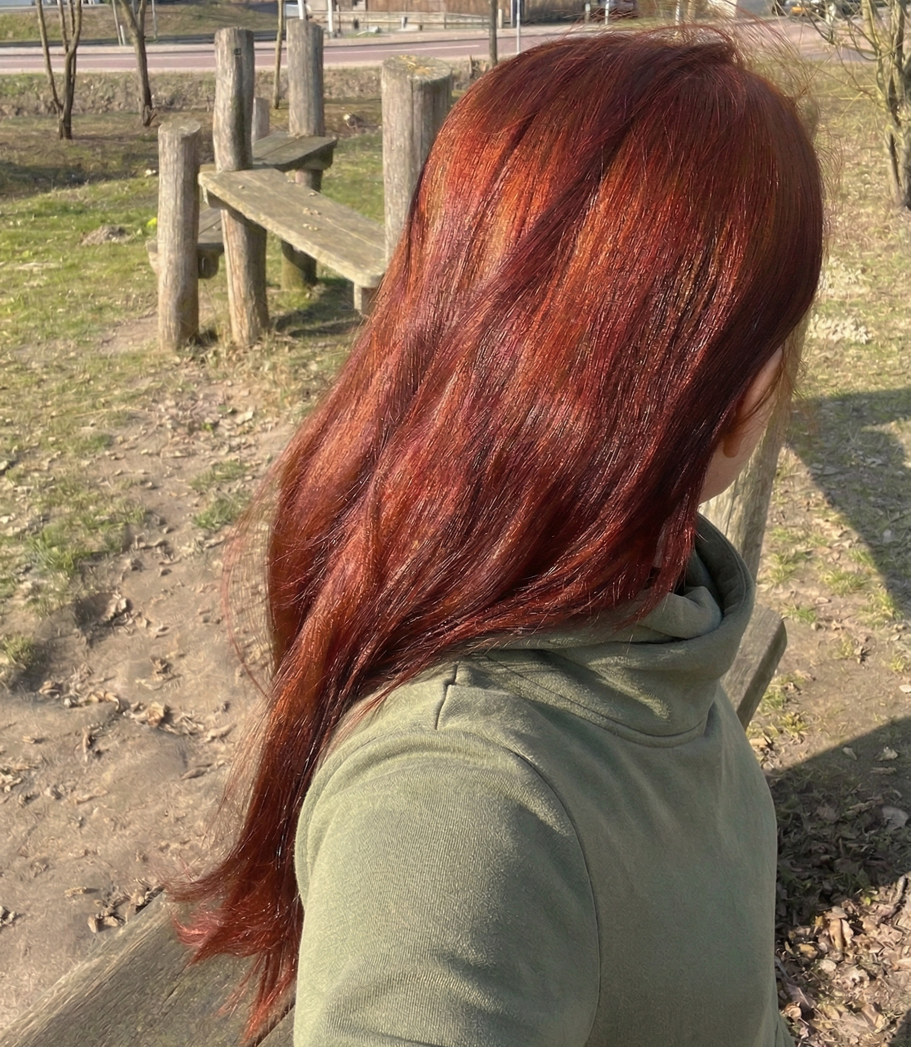 Girl with hair dyed with Hennatura henna based Auburn Red color