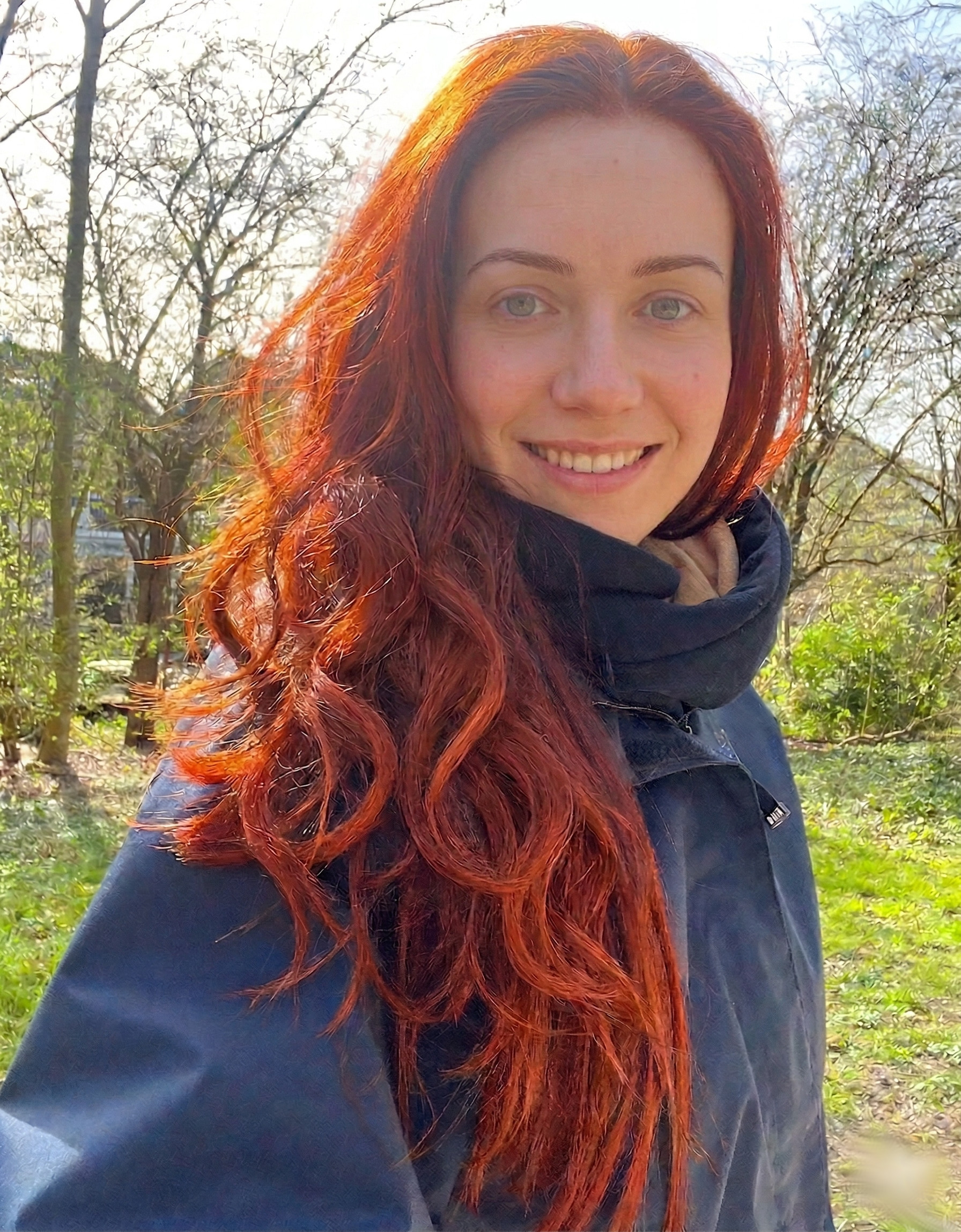 Girl with hair dyed with Hennatura henna based Natural Red color
