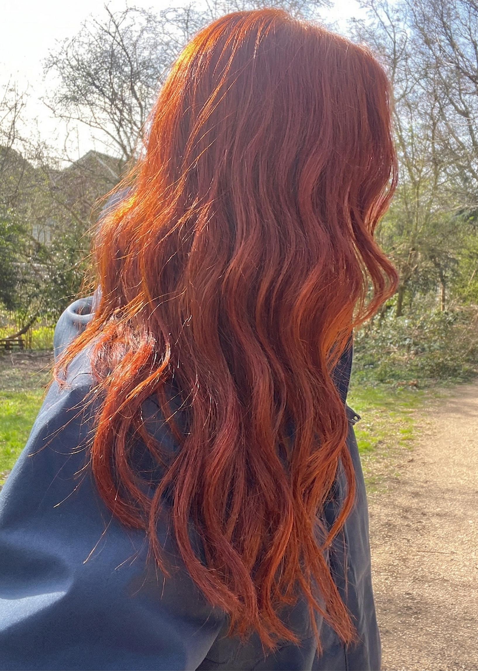 Girl with hair dyed with Hennatura henna based Natural Red color