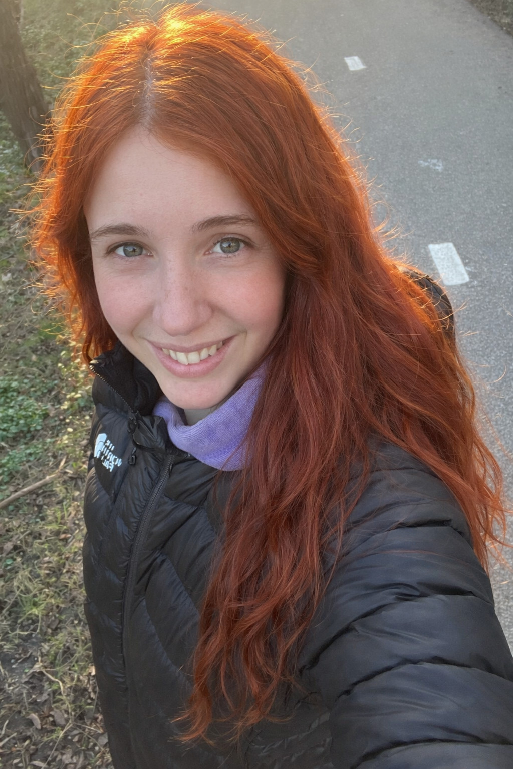 Girl with hair dyed with Hennatura henna based Natural Red color