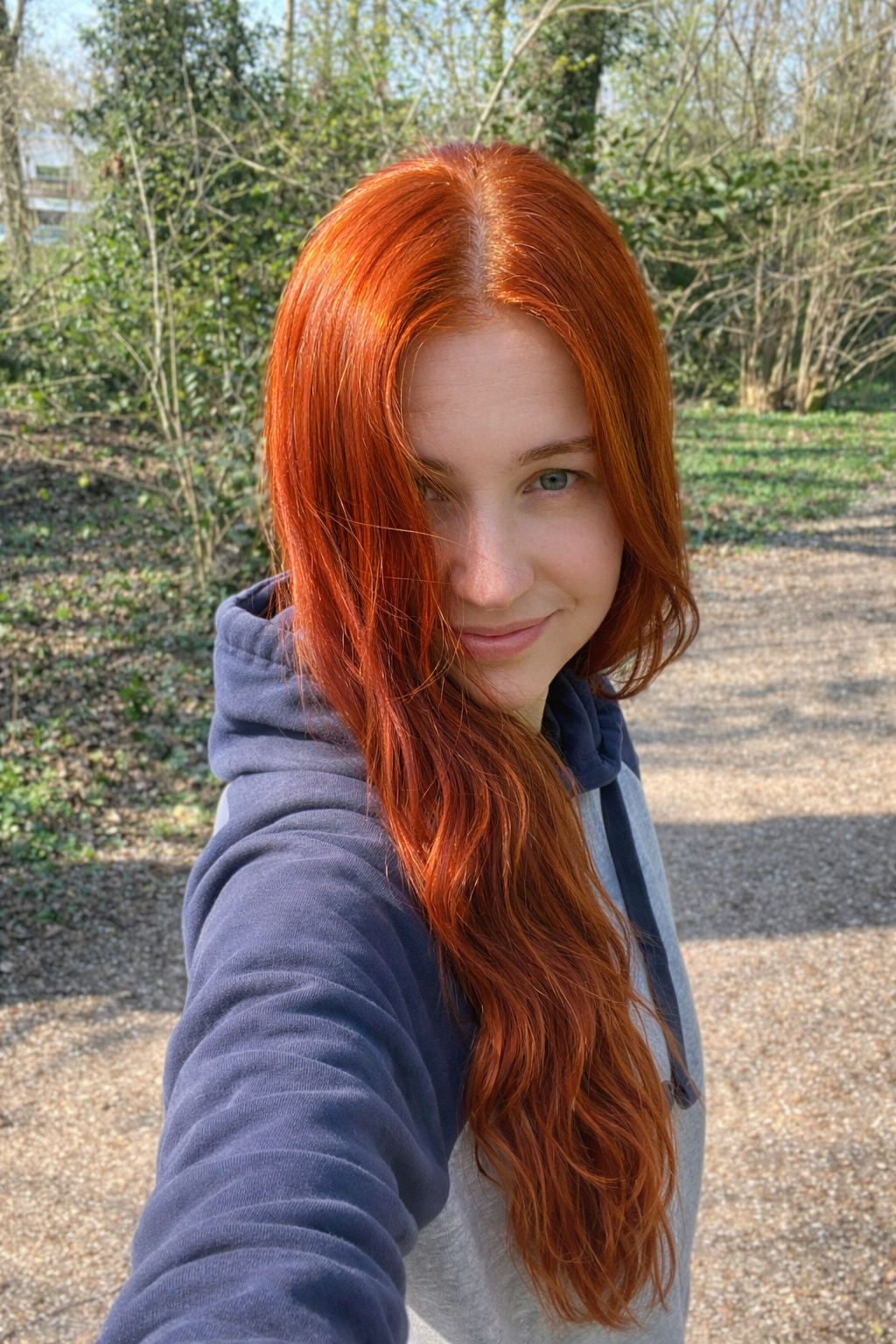 Girl with hair dyed with Hennatura henna based Natural Red color