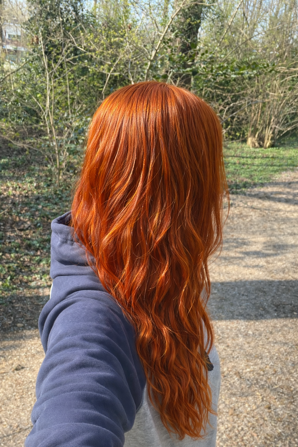 Girl with hair dyed with Hennatura henna based Natural Red color